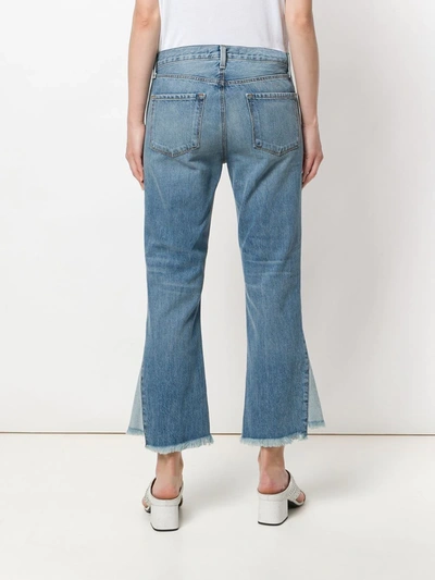 Shop J Brand Raw Edge Flared Jeans In Blue