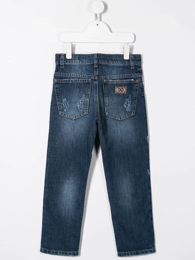 Shop Dolce & Gabbana Ripped Detail Jeans In Blue