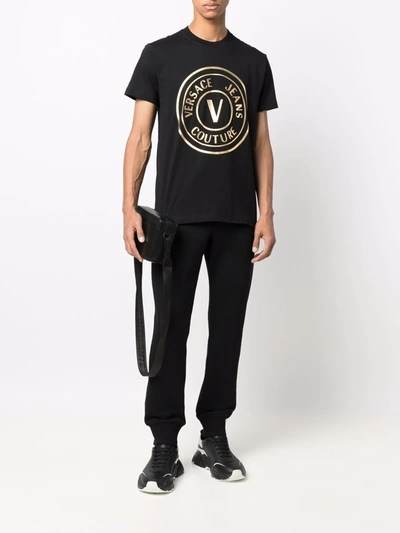 Shop Versace Jeans Couture Logo-embossed Cotton Track Pants In Black