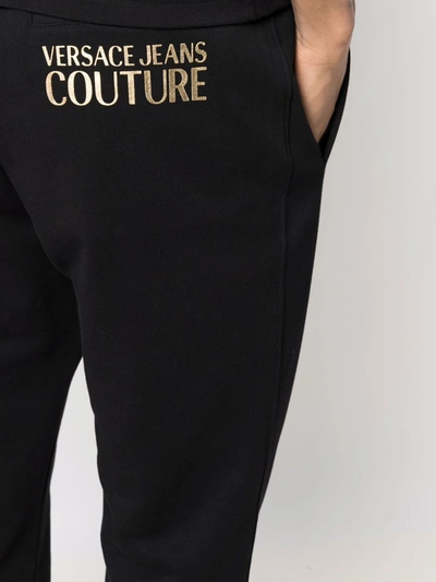 Shop Versace Jeans Couture Logo-embossed Cotton Track Pants In Black