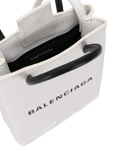 Shop Balenciaga Shopping Phone Bag On Strap In White