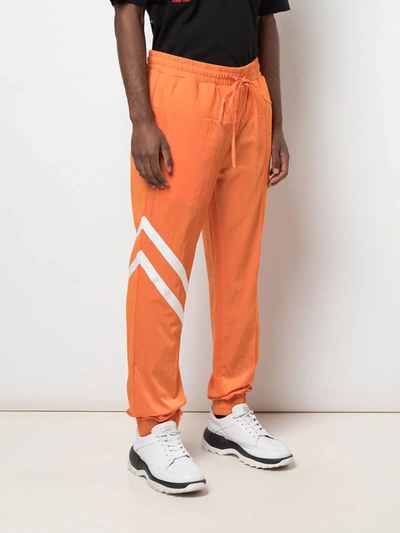Shop God's Masterful Children Geometric Panelled Track Pants In Orange
