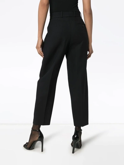Shop Alexander Mcqueen Tapered Pleated Trousers In Black