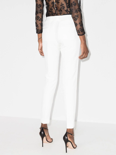 Saint Laurent Pleated Front Slim-fit Trousers In Nude