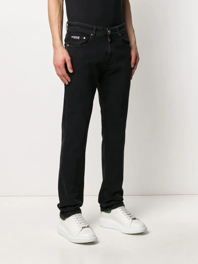 Shop Versace Jeans Couture Logo Print Straight Jeans In Black