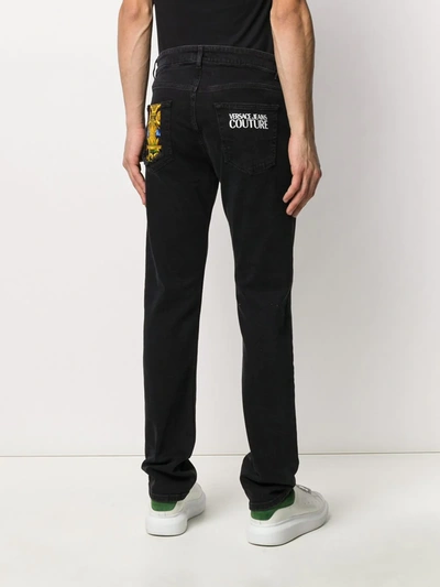 Shop Versace Jeans Couture Logo Print Straight Jeans In Black