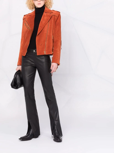 Shop Balmain X Netflix Fringed Suede Asymmetric-zip Biker Jacket In Orange