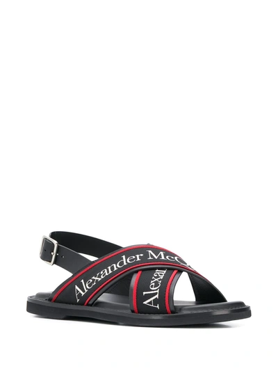 Shop Alexander Mcqueen Cross Strap Sandals In Black