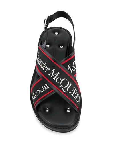 Shop Alexander Mcqueen Cross Strap Sandals In Black