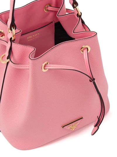 Shop Prada Triangle Patch Bucket Bag In Pink