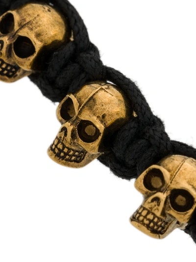 Shop Alexander Mcqueen Skulls Bracelet In Black