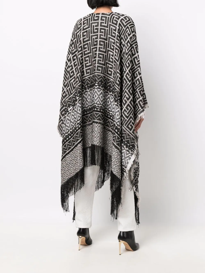 Shop Balmain Maxi Monogram Fringed Cape In Schwarz