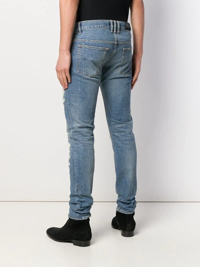 Shop Balmain Distressed Jeans In Blue