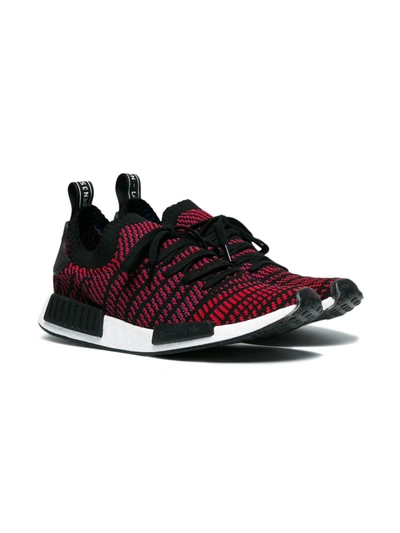 Black and red NMD R1 STLT sneakers