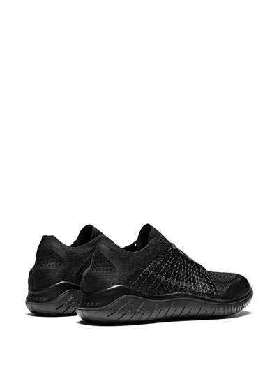 Shop Nike Free Rn Flyknit Sneakers In Black