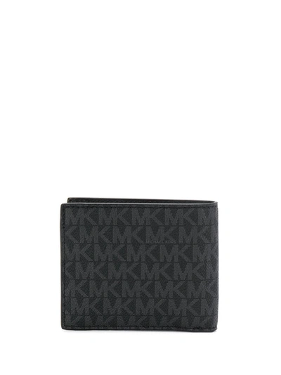 Shop Michael Michael Kors Logo-print Foldover Wallet In Black