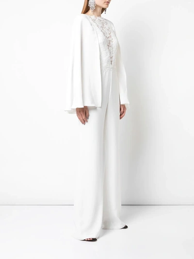 Shop Tadashi Shoji Lace-panelled Cape Jumpsuit In White