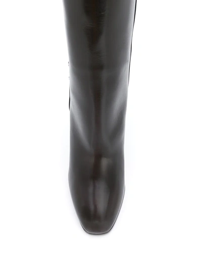 Shop Saint Laurent Jane Monogram Leather Boots In Brown