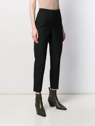 Shop Filippa K Fiona Peg Tapered-leg Trousers In Black