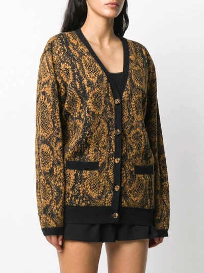 Shop Saint Laurent Snake Print Cardigan In Black