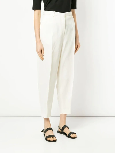 Shop Jil Sander Creased Tapered Trousers In White