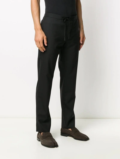 Shop Maison Margiela Four Stitch Detail Tailored Trousers In Black