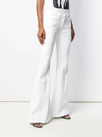 Shop Faith Connexion Low-rise Flared Jeans In White