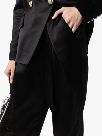 Shop Balmain Tapered Silk-satin Trousers In Black