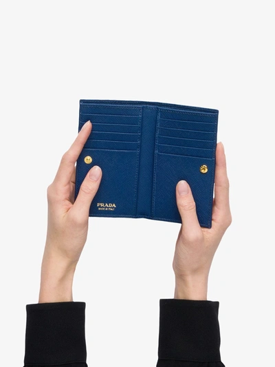 Shop Prada Saffiano Bi-fold Wallet In Blue