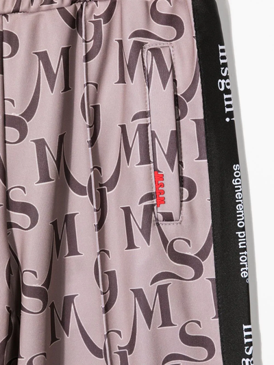 Shop Msgm Monogram Print Trousers In Brown