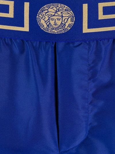 Versace Logo Embroidered Swim Shorts In Blue