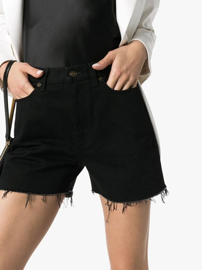 Shop Saint Laurent Fringed Denim Shorts In Black