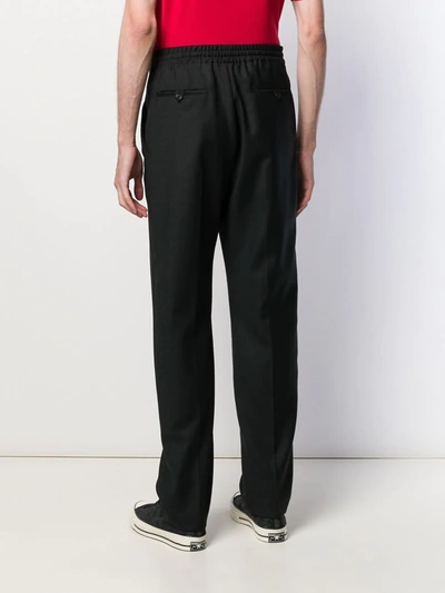 Shop Saint Laurent Belted Tailored Trousers In Black