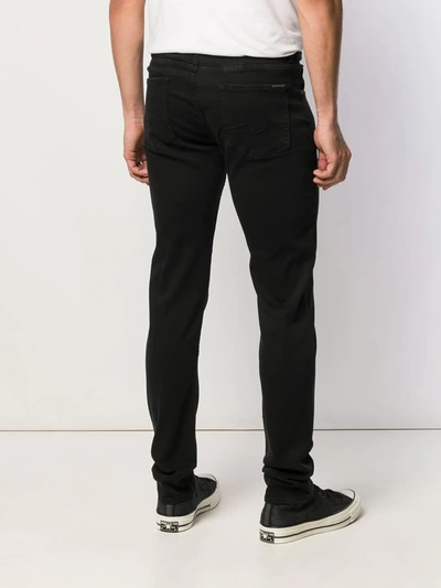 Shop 7 For All Mankind Slimmy Tapered Jeans In Black