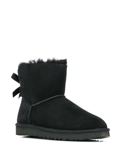 Shop Ugg Mini Bailey Bow Boots In Black