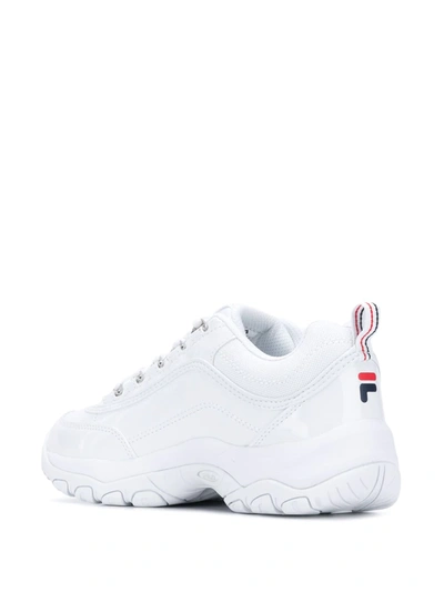 Shop Fila Strada Chunky Sole Sneakers In White