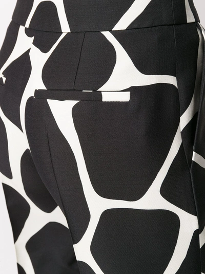 Shop Valentino Giraffe Print Palazzo Trousers In Black