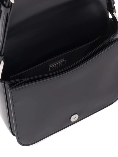 Shop Prada Brushed Leather Shoulder Bag In Schwarz