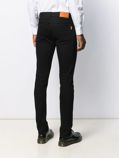 Shop Sandro Mid-rise Slim-cut Jeans In Black