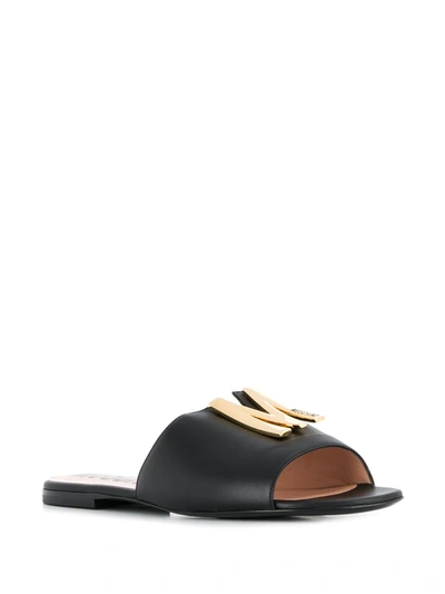 Shop Moschino M Plaque Sandals In Black