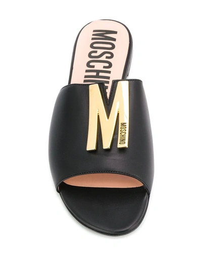 Shop Moschino M Plaque Sandals In Black