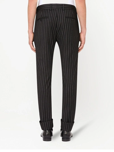 Shop Dolce & Gabbana Pinstripe Wool Trousers In Black