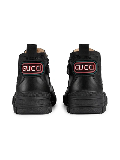 Shop Gucci Logo Patch Ankle Boots In Black