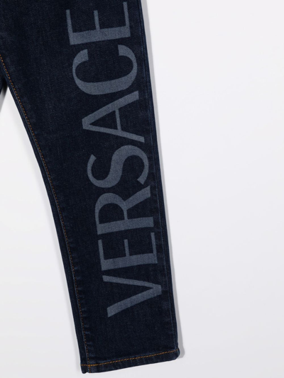 Shop Versace Logo Print Jeans In Blue