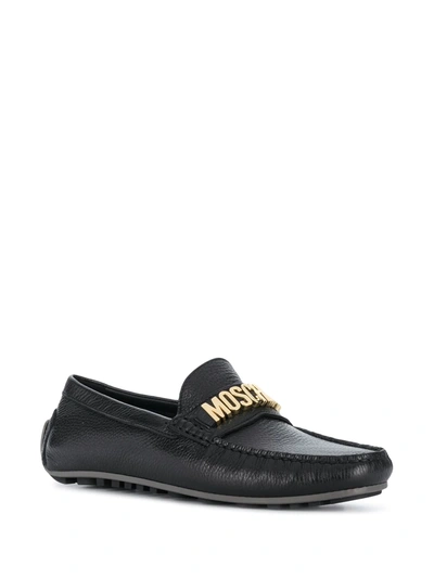 Shop Moschino Lettering Logo Leather Loafers In Black