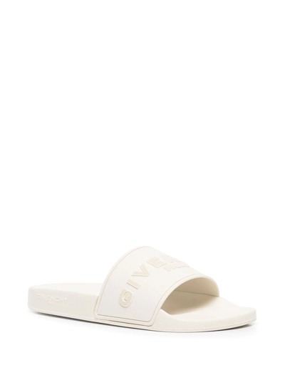 Shop Givenchy Raised-logo Slides In White