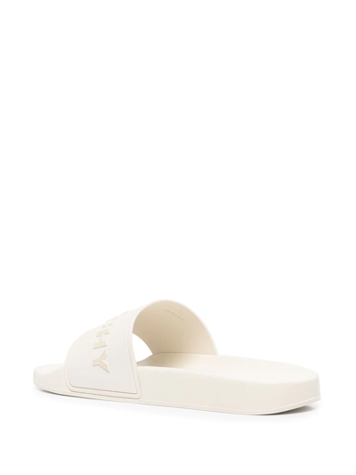 Shop Givenchy Raised-logo Slides In White