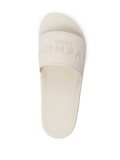 Shop Givenchy Raised-logo Slides In White