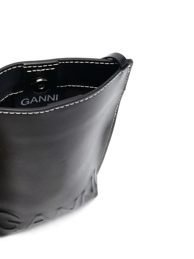 Shop Ganni Embossed-logo Crossbody Bag In Black