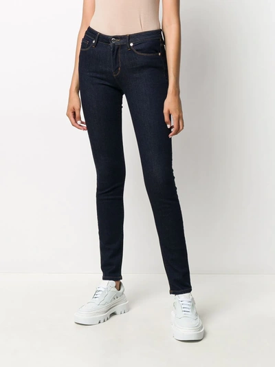 Shop Love Moschino Embroidered Logo Skinny Jeans In Blue